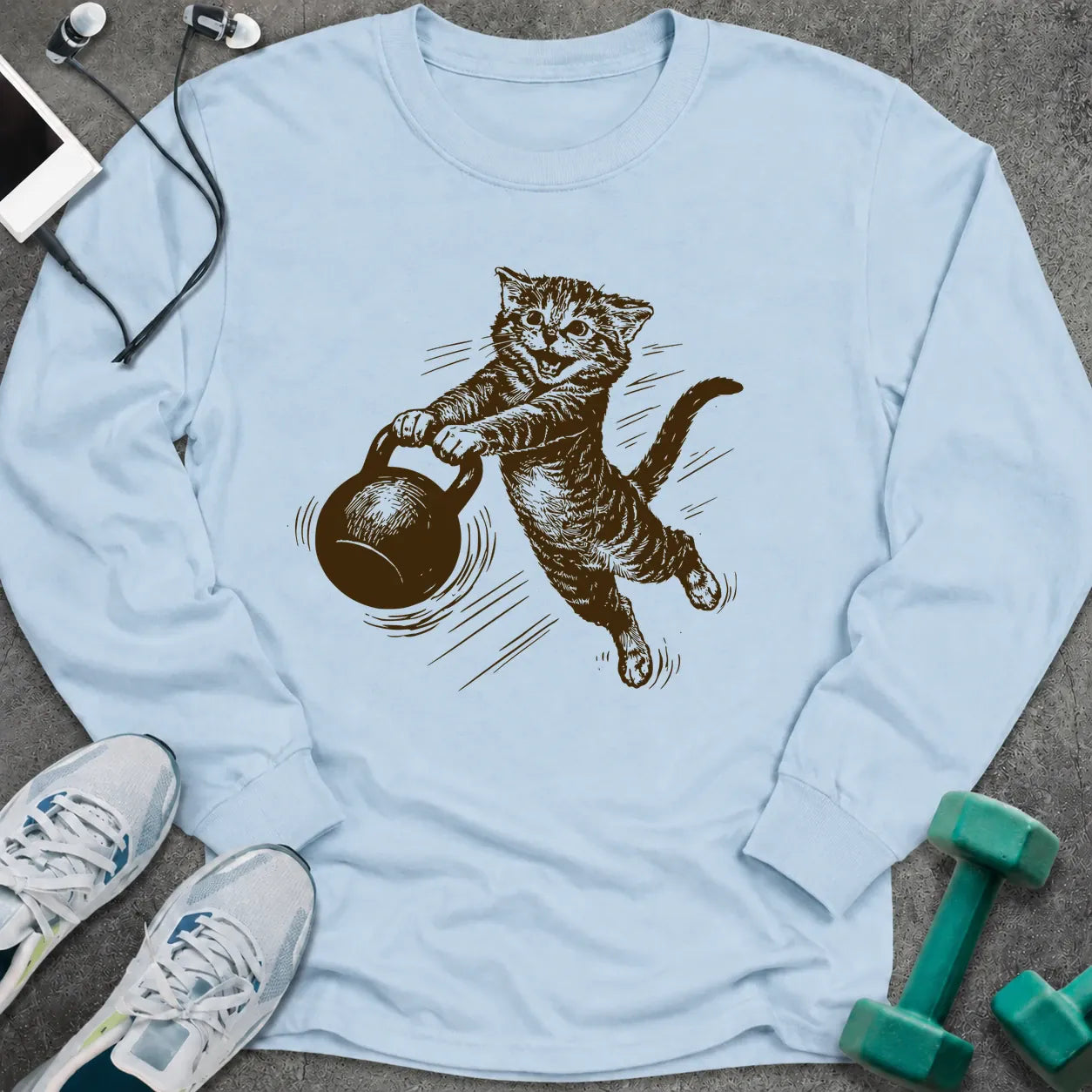 Light blue long sleeve tee printed with a sepia sketch of a cat swinging a kettlebell
