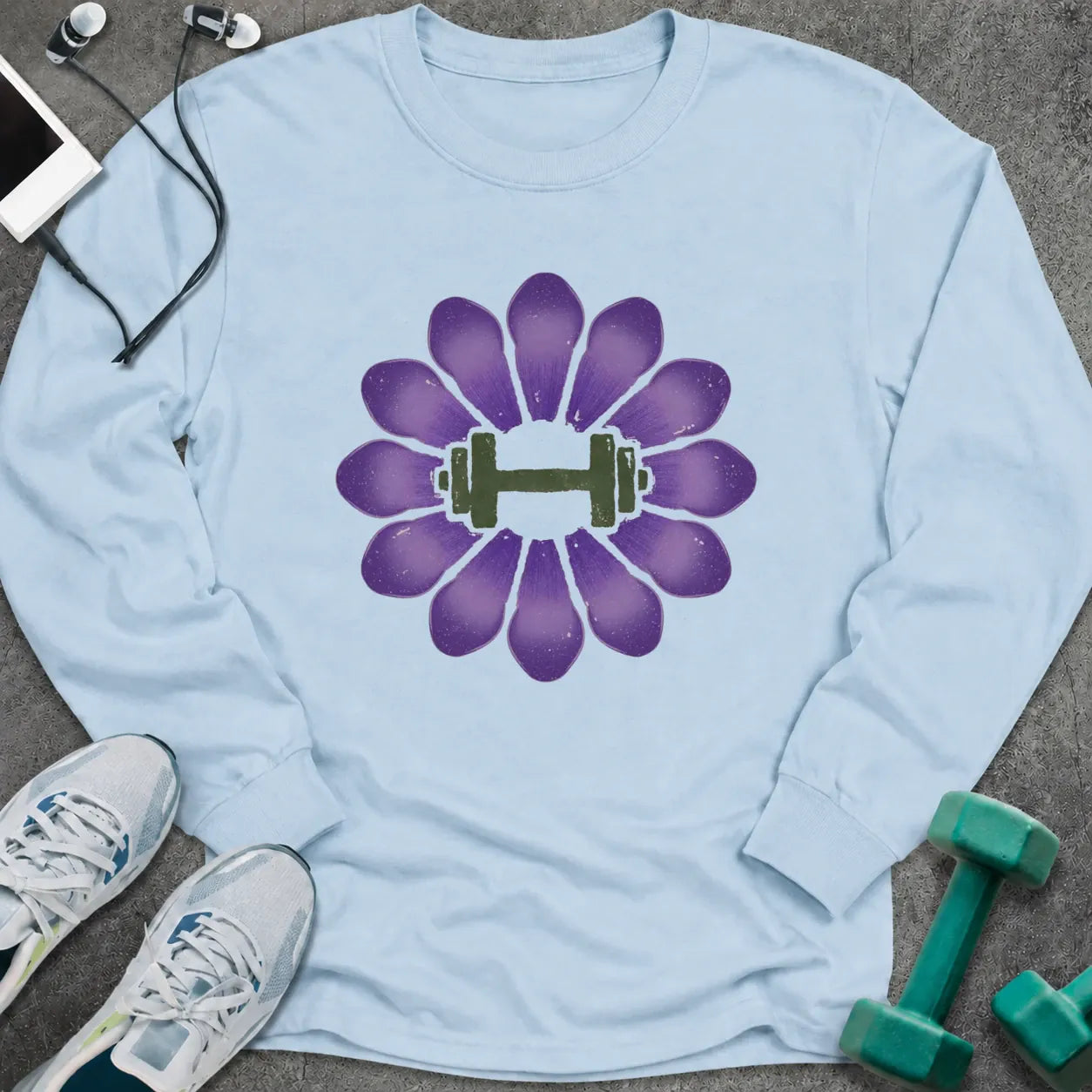 Light blue long sleeve tee printed with a purple crocus with a green dumbbell at its center