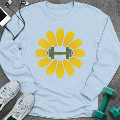 Light blue long sleeve tee printed with a yellow flower with a green dumbbell at its center