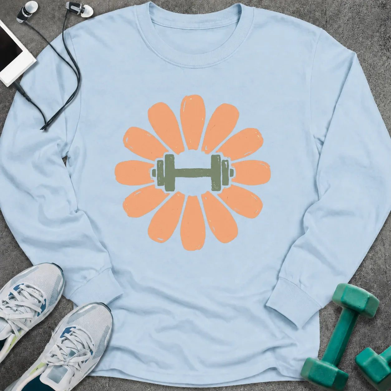 Light blue long sleeve tee printed with a peach flower with a green dumbbell at its center