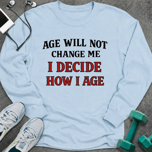 Light blue long sleeve tee printed with "Age Will Not Change Me, I Decide How I Age" in black and red