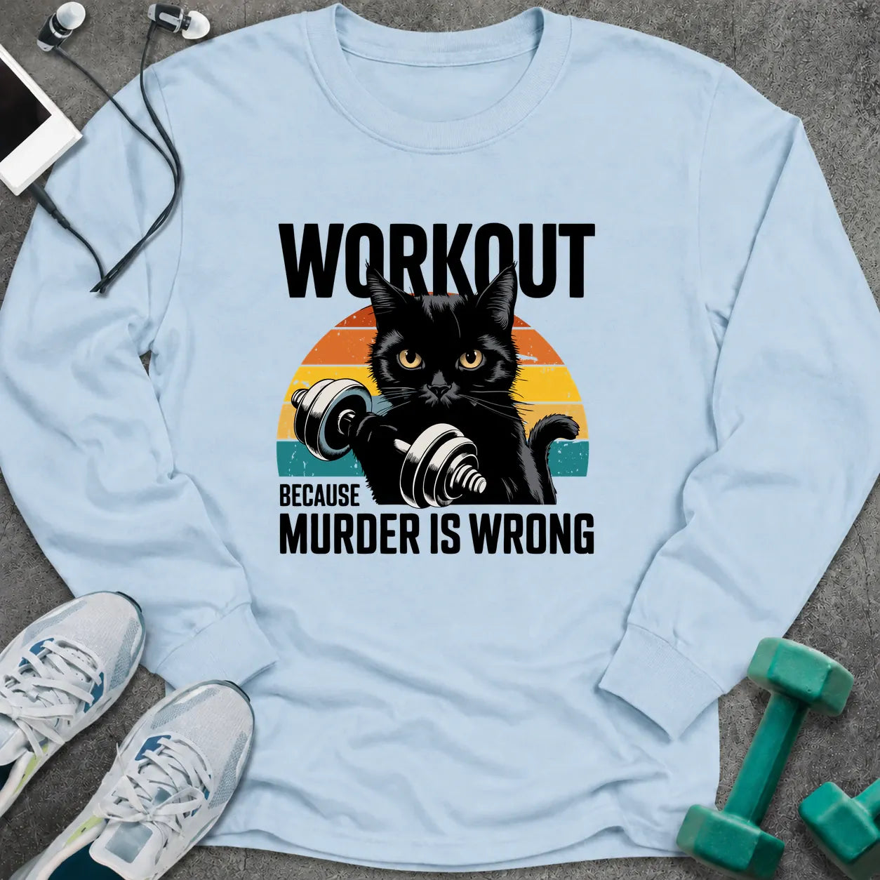 Light blue long sleeve tee printed with "Workout Because Murder Is Wrong" in black, with a black cat holding a dumbbell over a retro sunburst