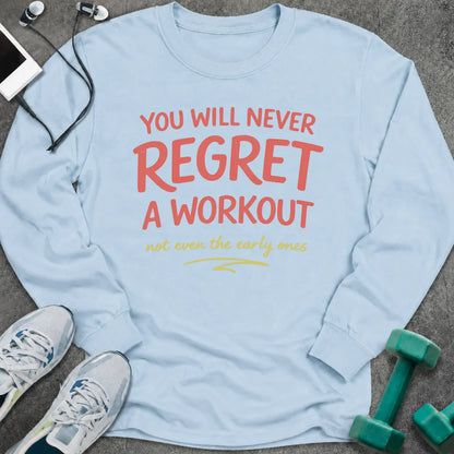 Light blue long sleeve tee printed with "You Will Never Regret A Workout, not even the early ones" in coral and gold