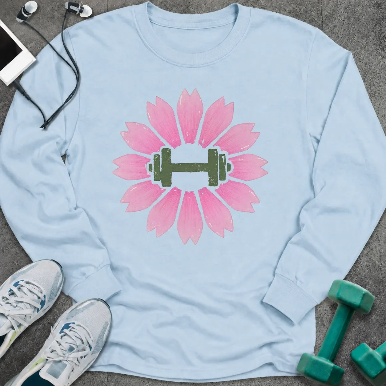 Light blue long sleeve tee printed with a pink cherry blossom with a green dumbbell at its center
