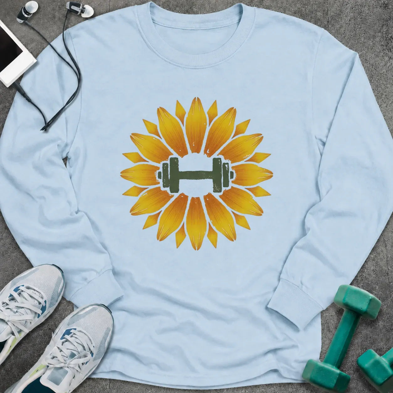 Light blue long sleeve tee printed with a sunflower with a green dumbbell at its center