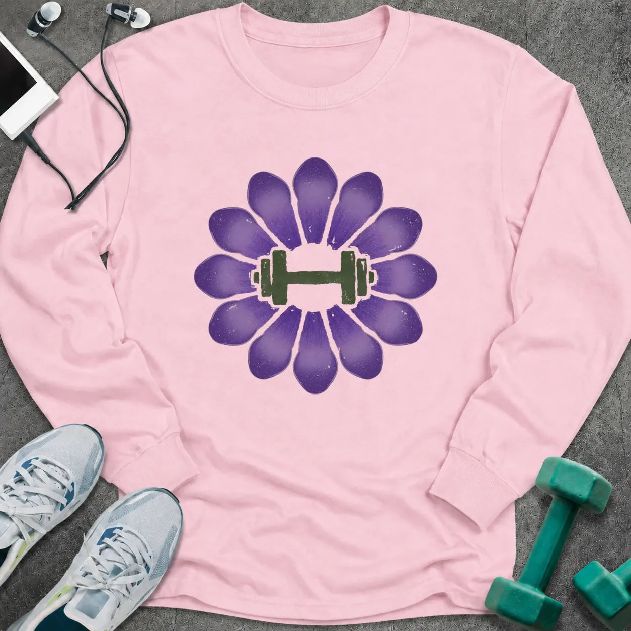 Light pink long sleeve tee printed with a purple crocus with a green dumbbell at its center