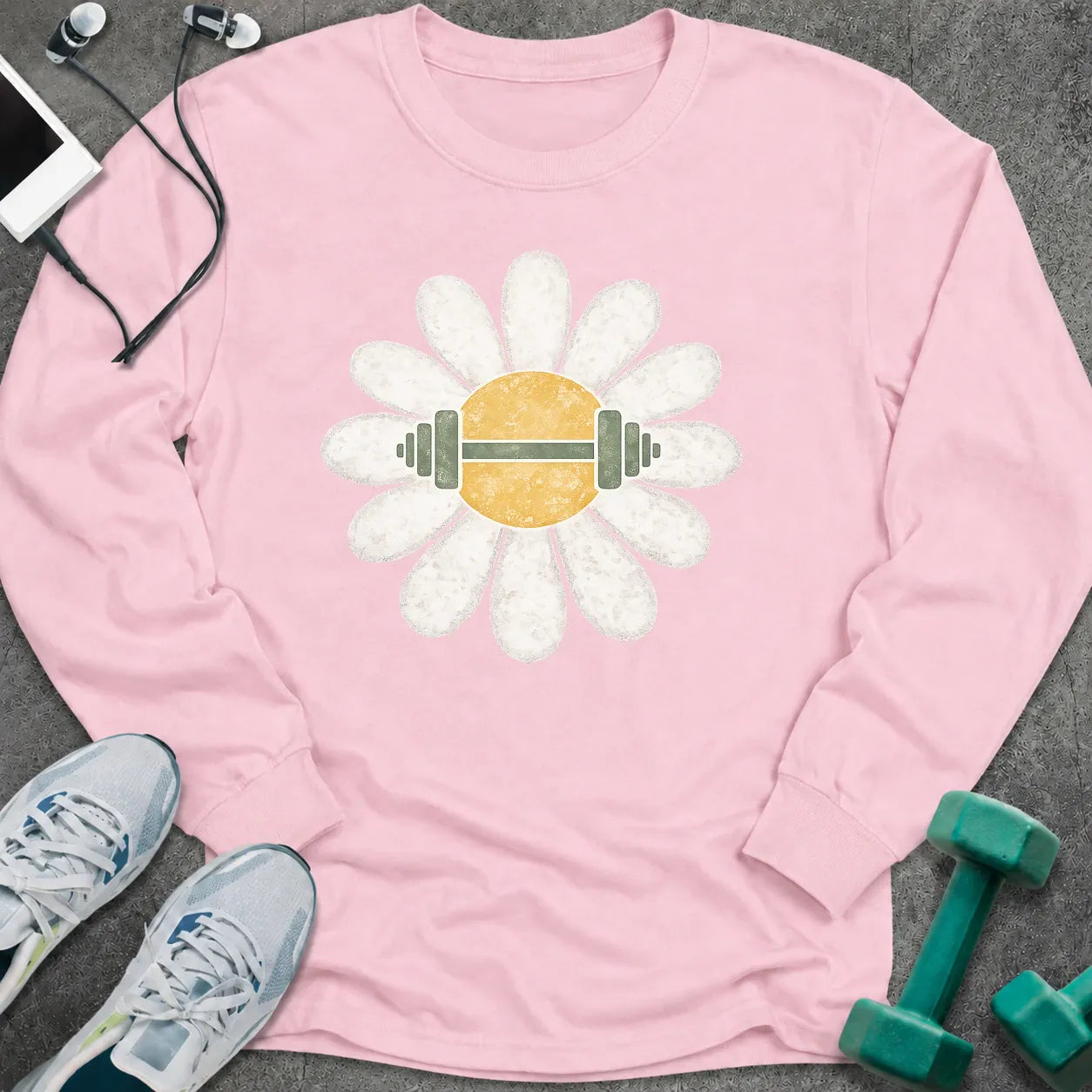 Light pink long sleeve tee printed with a white daisy with a barbell through its center
