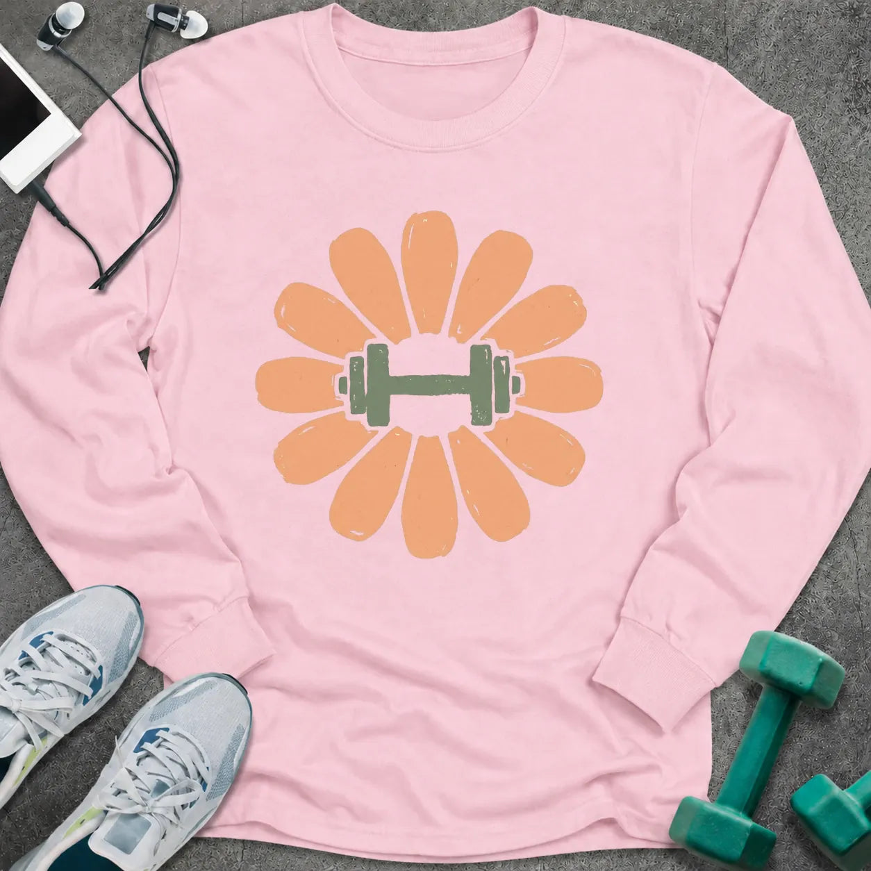 Light pink long sleeve tee printed with a peach flower with a green dumbbell at its center