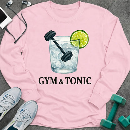 Light pink long sleeve tee printed with "Gym & Tonic" in black, with a tonic glass holding a lime wedge and a dumbbell