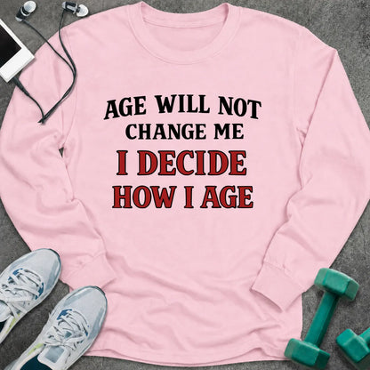 Light pink long sleeve tee printed with "Age Will Not Change Me, I Decide How I Age" in black and red