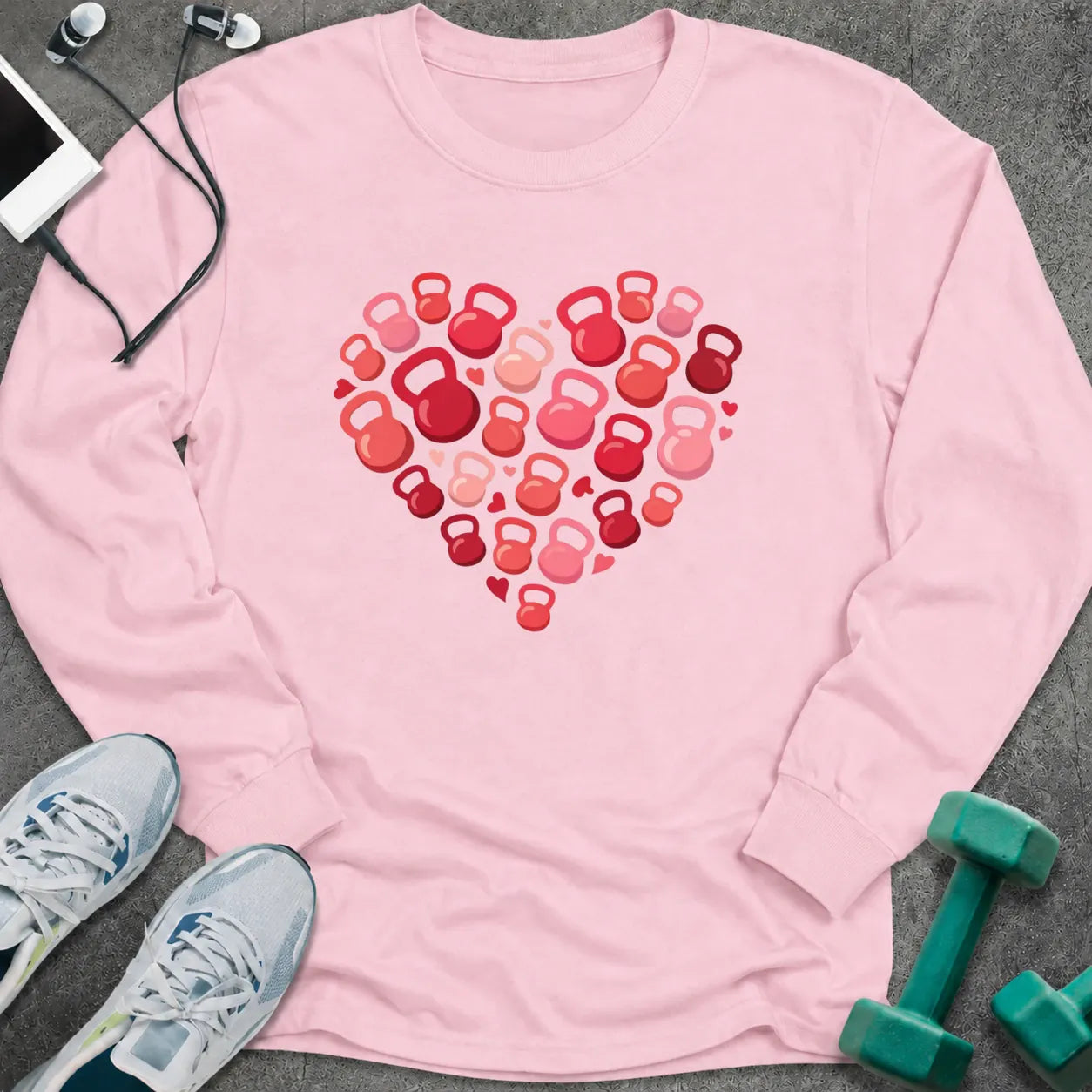 Light pink long sleeve tee printed with a heart built from red and pink kettlebells