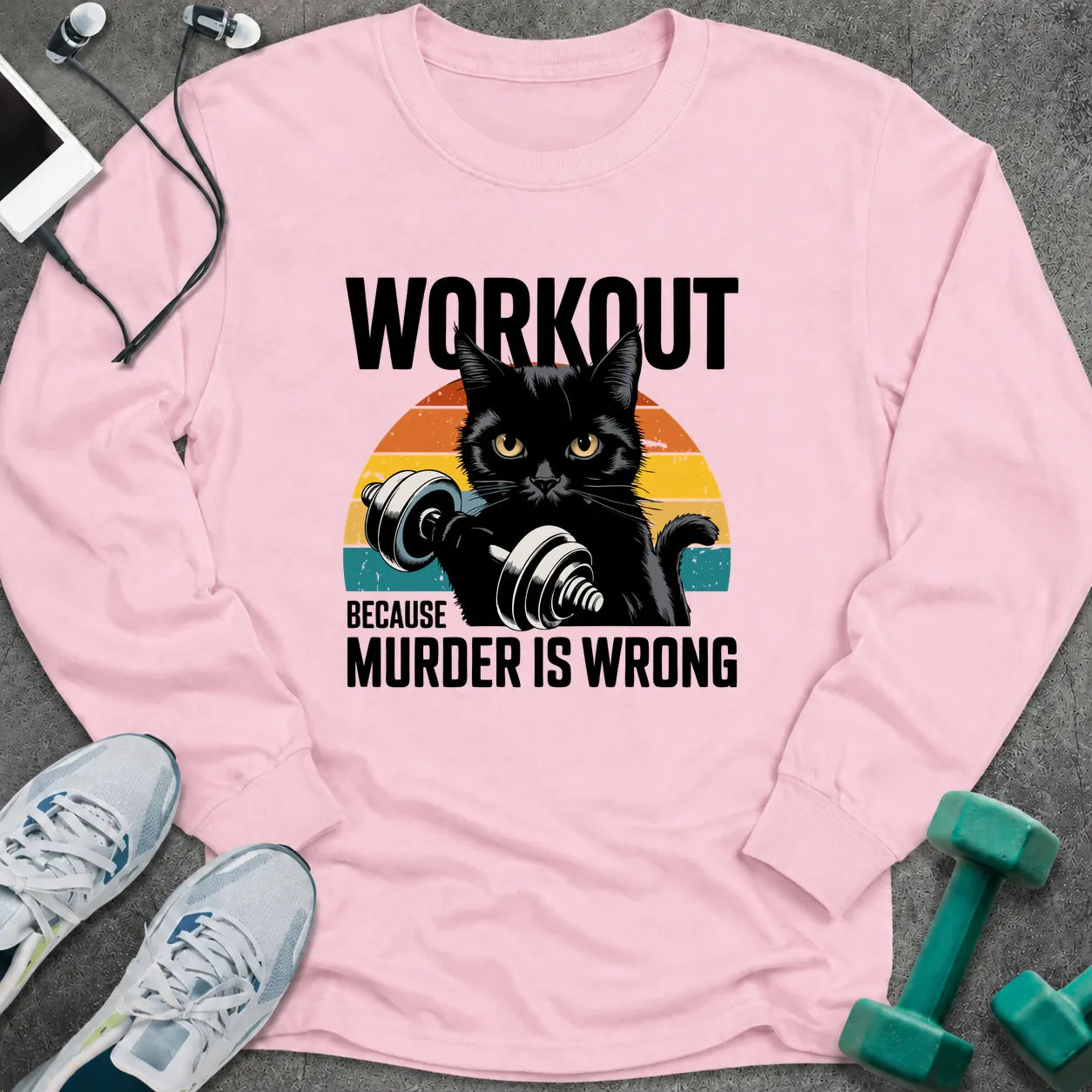 Light pink long sleeve tee printed with "Workout Because Murder Is Wrong" in black, with a black cat holding a dumbbell over a retro sunburst
