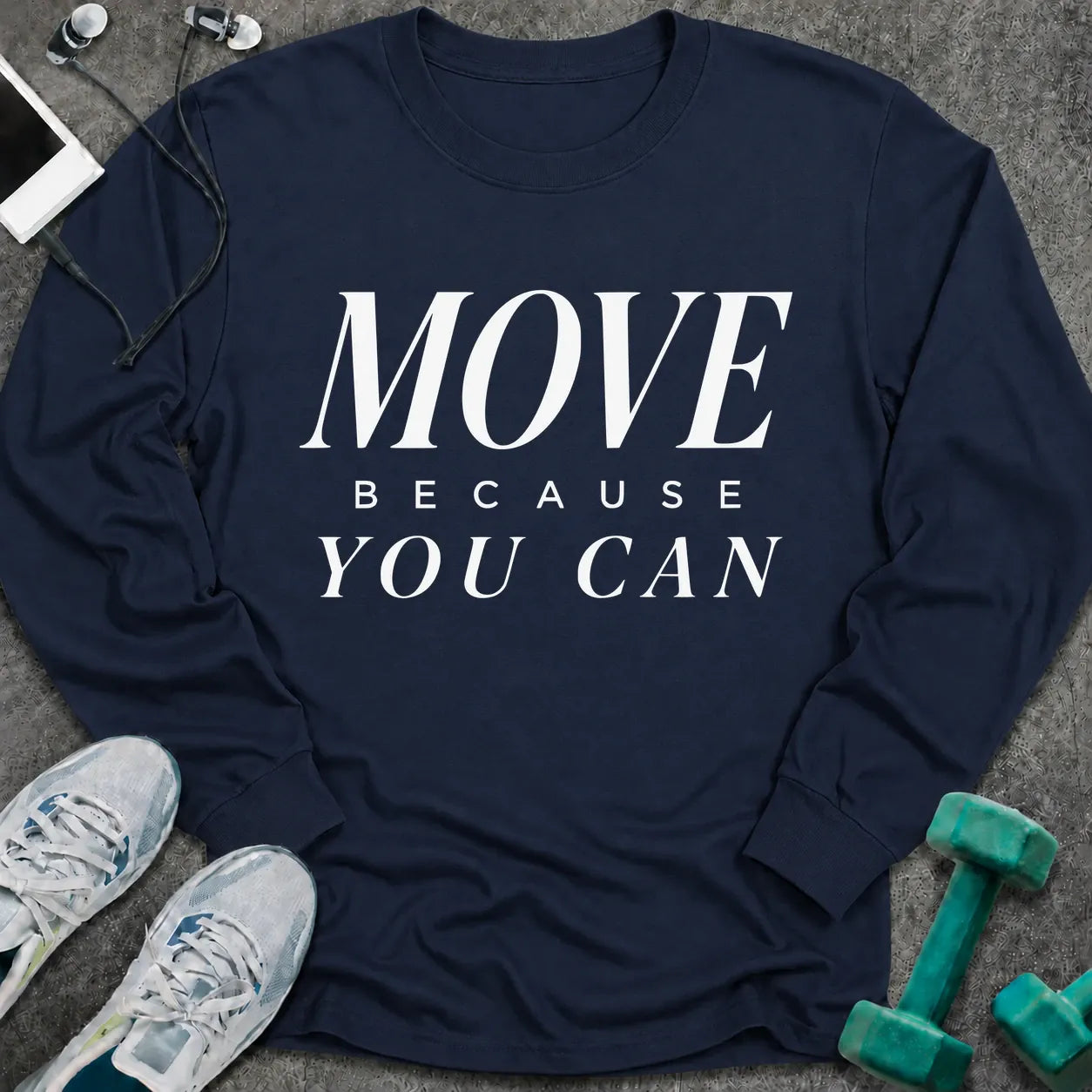 Navy long sleeve tee printed with "Move Because You Can" in white serif lettering