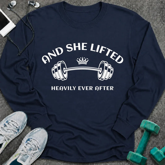 Navy long sleeve tee printed with "And She Lifted Heavily Ever After" in white, with a barbell topped with a crown