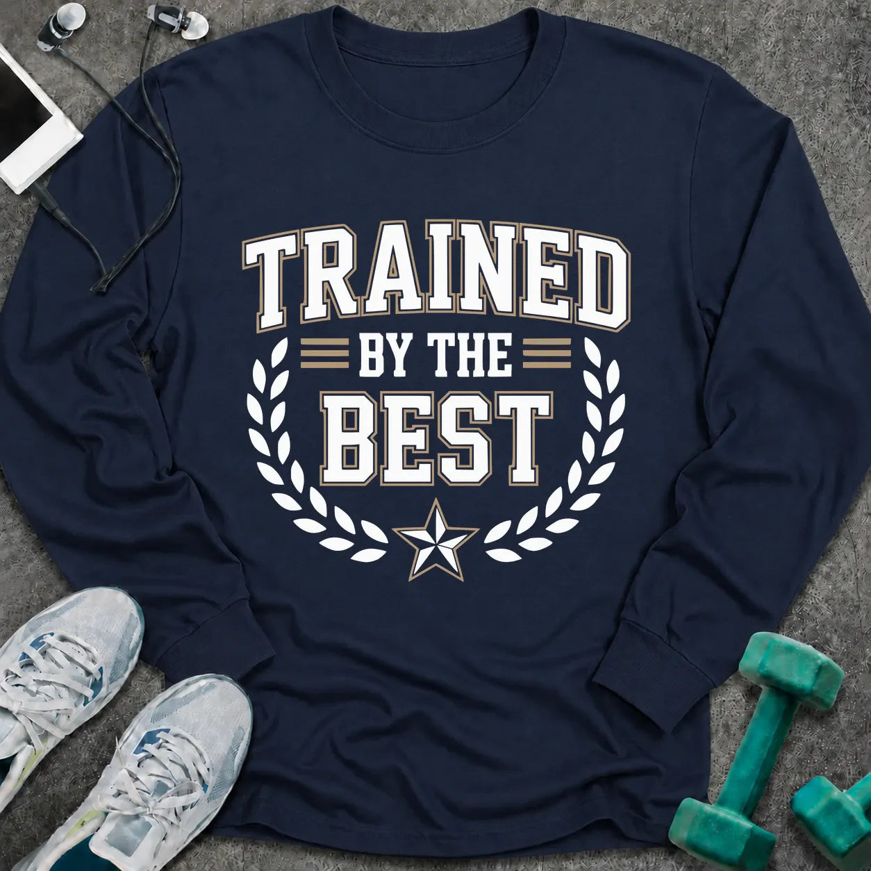 Navy long sleeve tee printed with "Trained By The Best" in white, with a laurel wreath and star