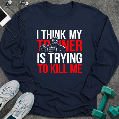 Navy long sleeve tee printed with "I Think My Trainer Is Trying To Kill Me" in white and red, with a trainer figure behind the lettering