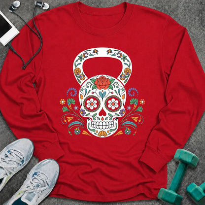 Red long sleeve tee printed with a sugar skull kettlebell covered in colorful flowers