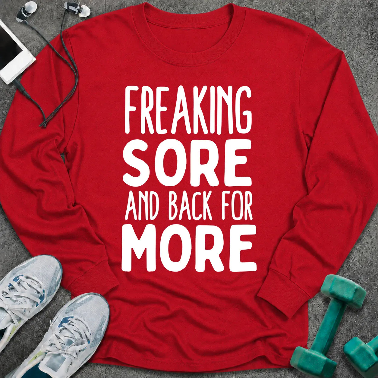 Red long sleeve tee printed with "Freaking Sore And Back For More" in white