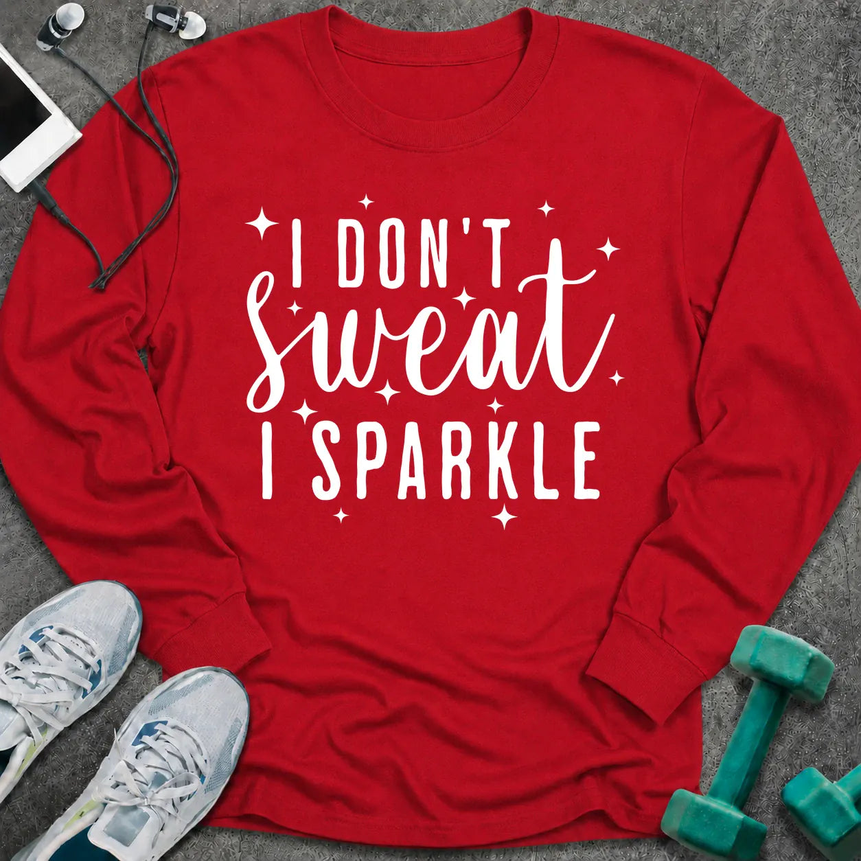 Red long sleeve tee printed with "I Don't Sweat I Sparkle" in white script, with sparkle stars