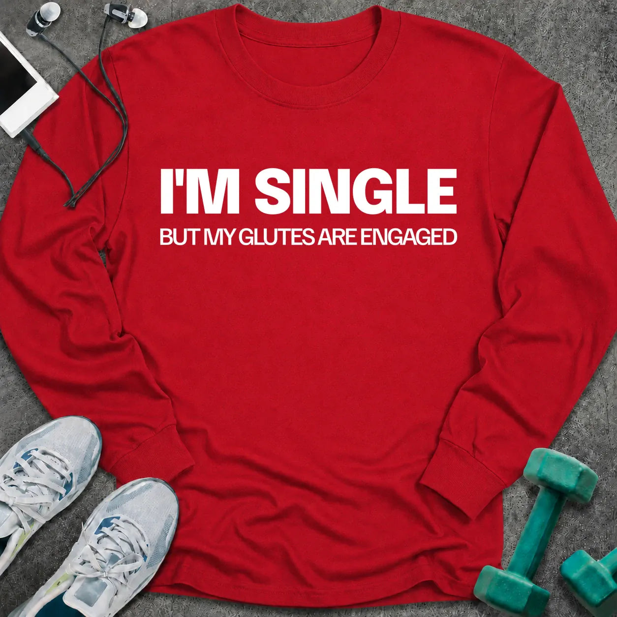 Red long sleeve tee printed with "I'm Single But My Glutes Are Engaged" in white
