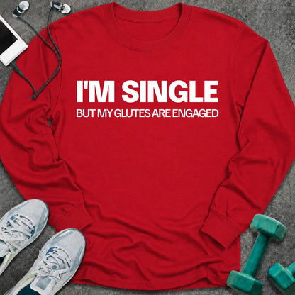 Red long sleeve tee printed with "I'm Single But My Glutes Are Engaged" in white