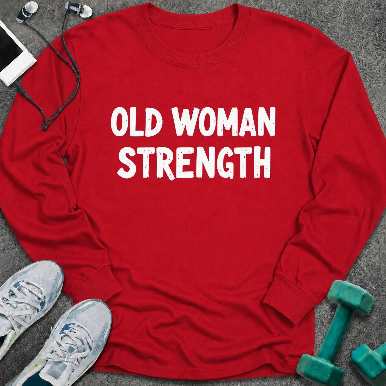 Red long sleeve tee printed with "Old Woman Strength" in white