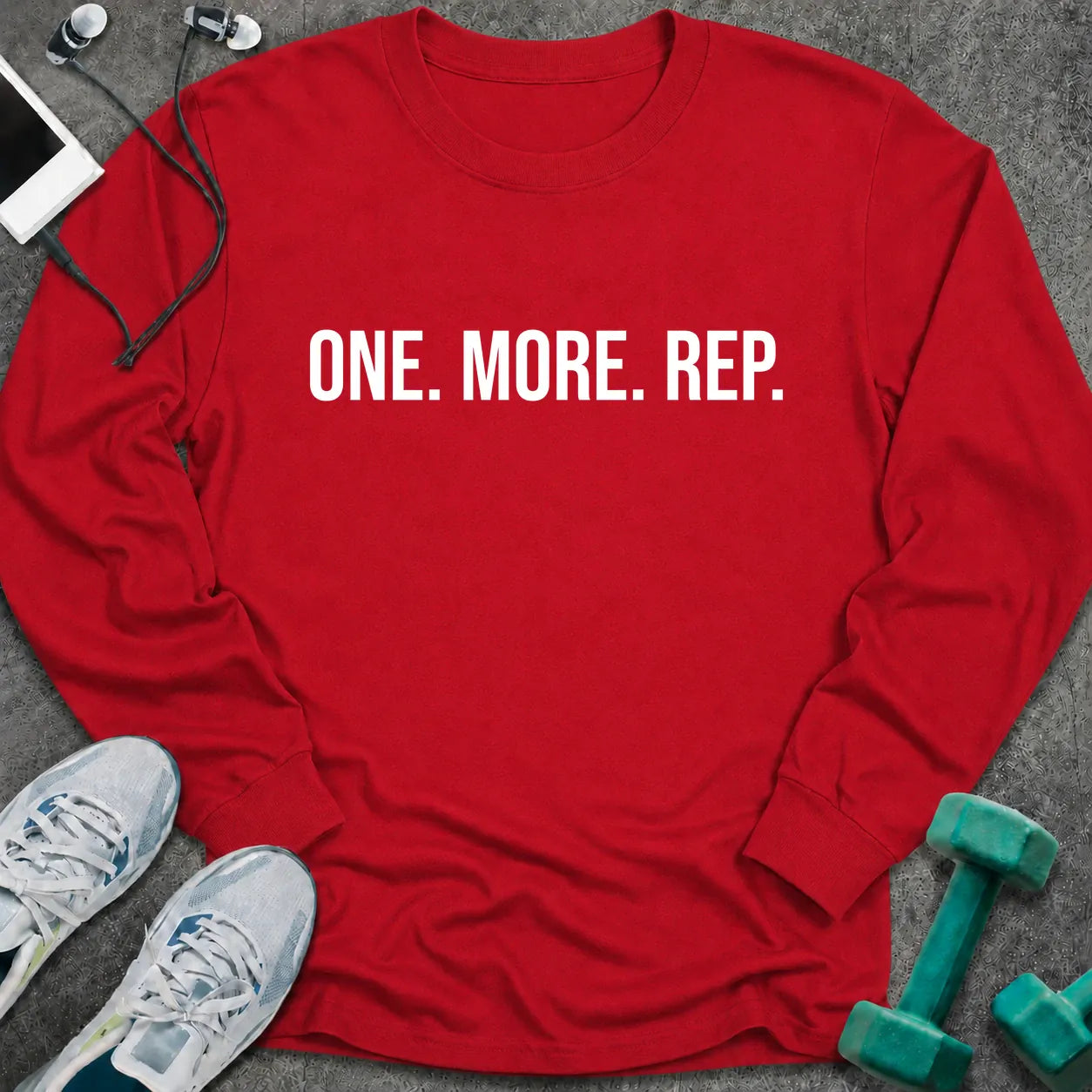 Red long sleeve tee printed with "One. More. Rep." in white