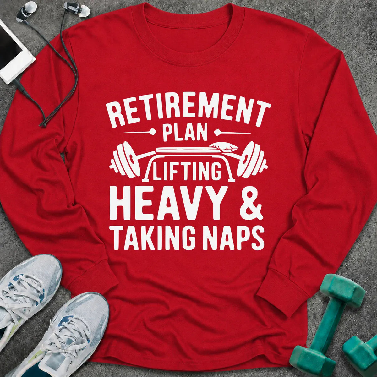 Red long sleeve tee printed with "Retirement Plan: Lifting Heavy & Taking Naps" in white, with a barbell