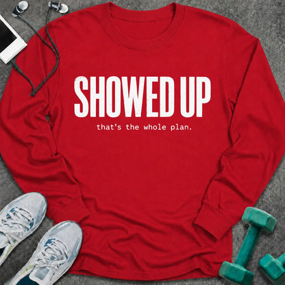 Red long sleeve tee printed with "Showed Up. that's the whole plan." in white