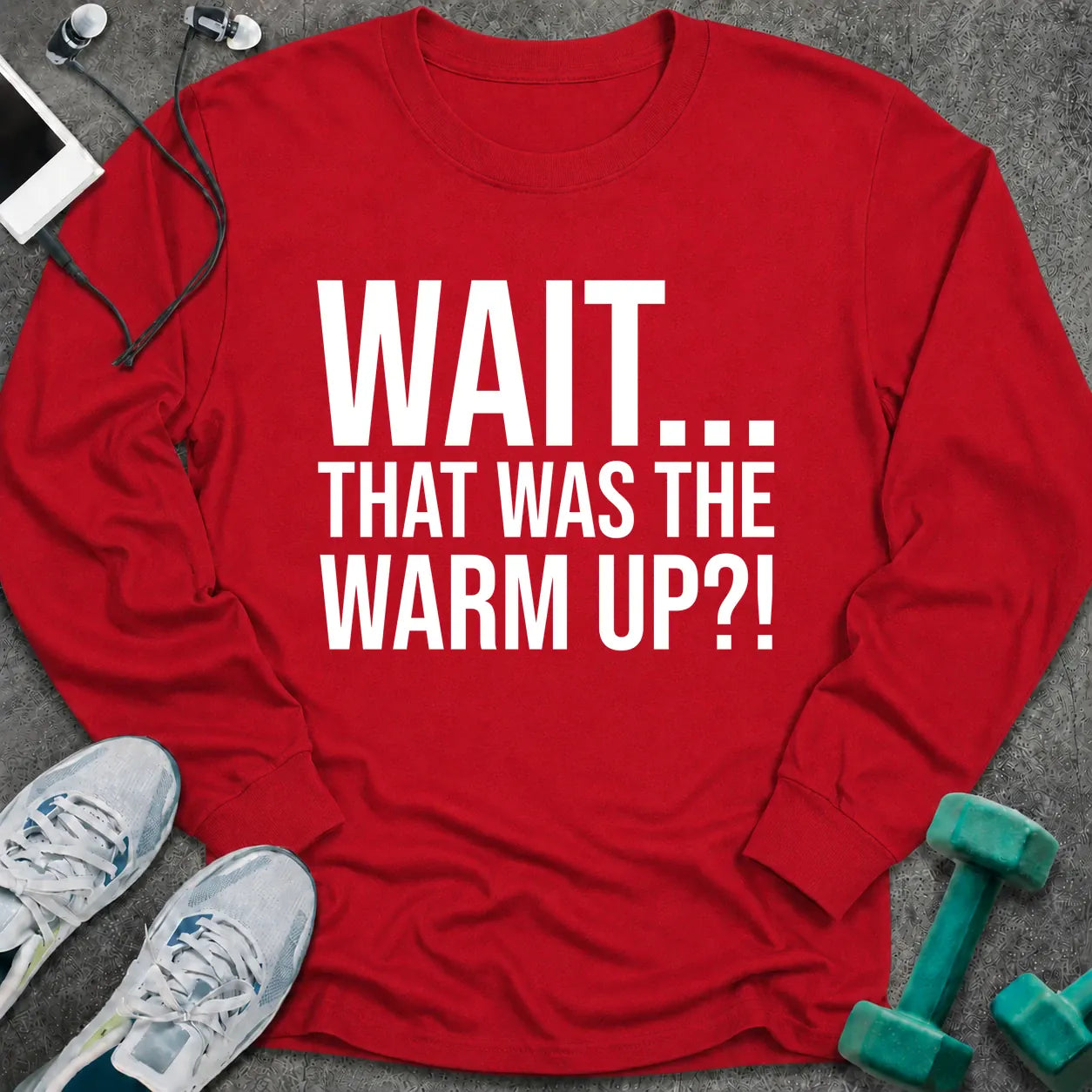Red long sleeve tee printed with "Wait... That Was The Warm Up?!" in white