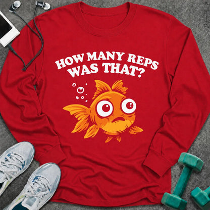 Red long sleeve tee printed with "How Many Reps Was That?" in white, with a wide-eyed goldfish