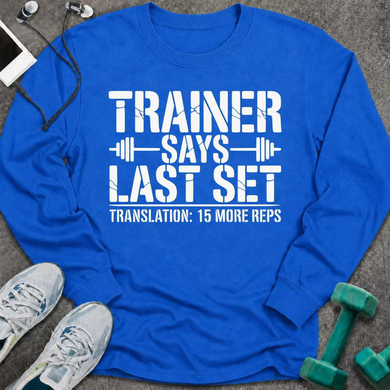Royal long sleeve tee printed with "Trainer Says Last Set. Translation: 15 More Reps" in white, with barbell accents