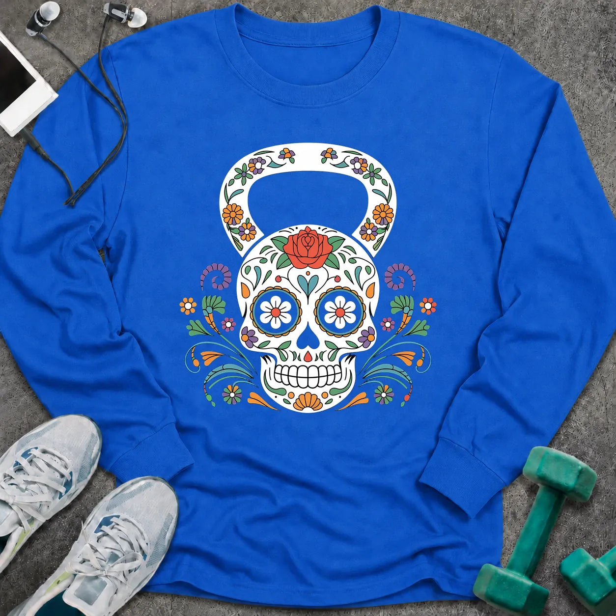 Royal long sleeve tee printed with a sugar skull kettlebell covered in colorful flowers