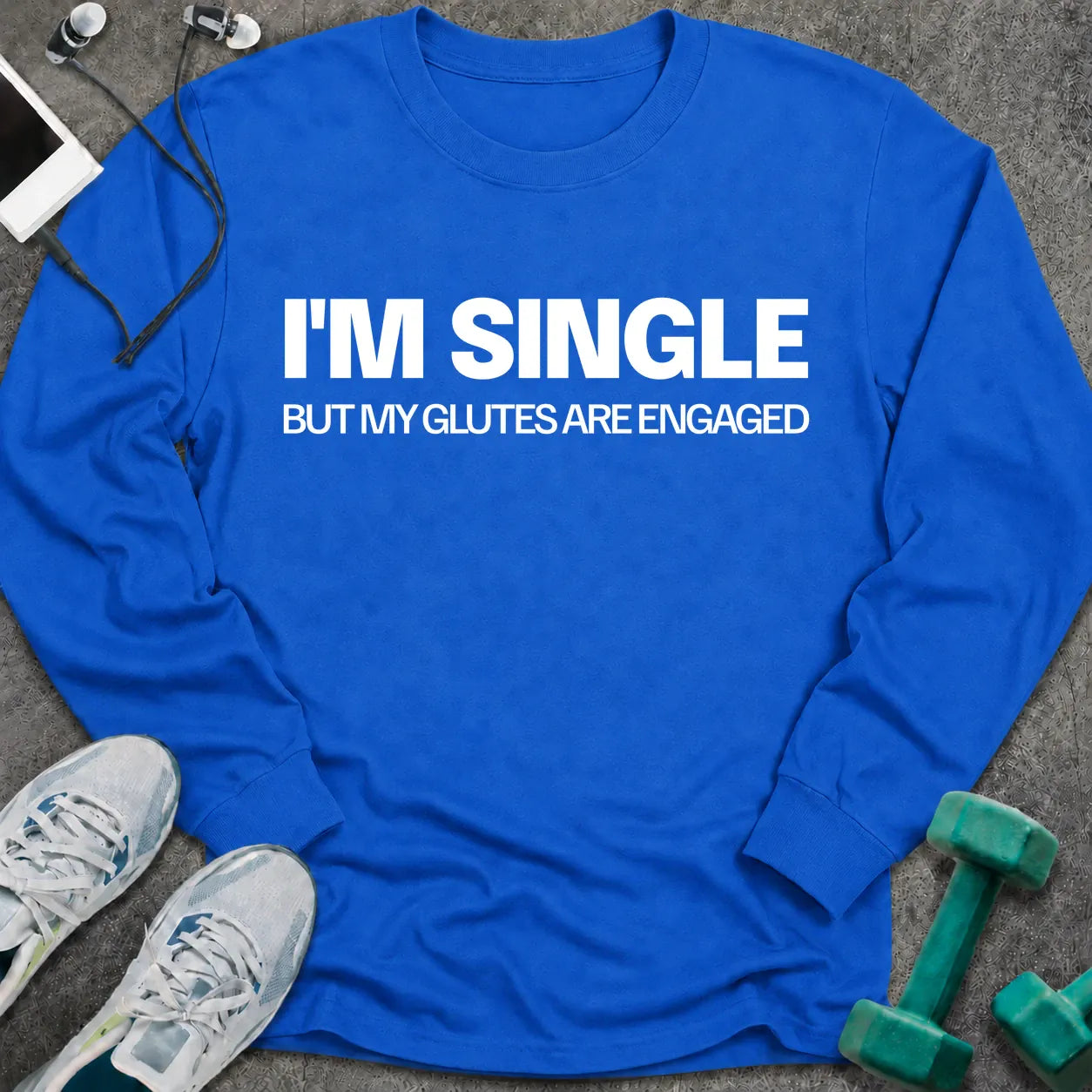 Royal long sleeve tee printed with "I'm Single But My Glutes Are Engaged" in white