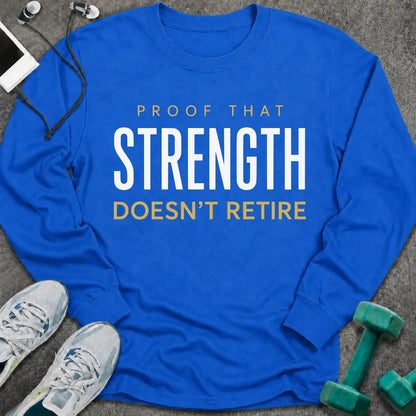 Royal long sleeve tee printed with "Proof That Strength Doesn't Retire" in white and gold