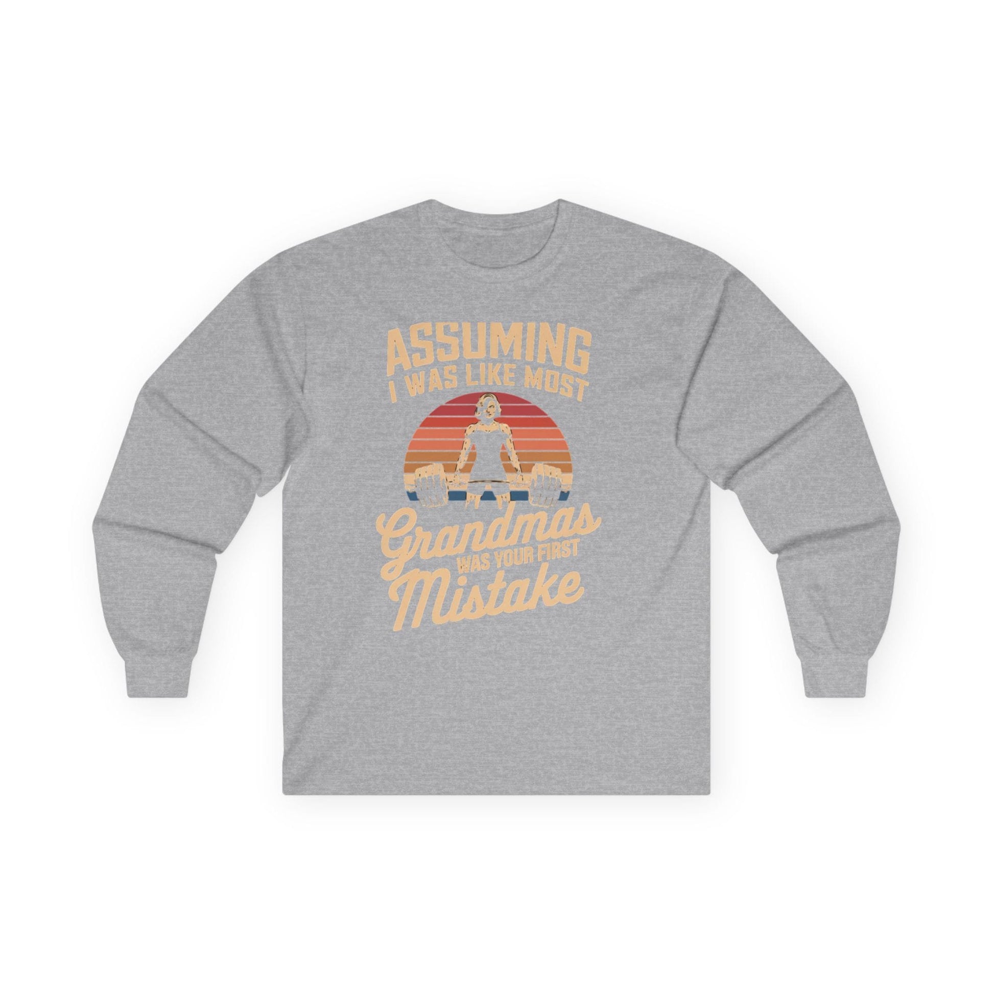 Sport grey long sleeve tee printed with "Assuming I Was Like Most Grandmas Was Your First Mistake" in cream and gold, with a woman deadlifting inside a retro sunburst