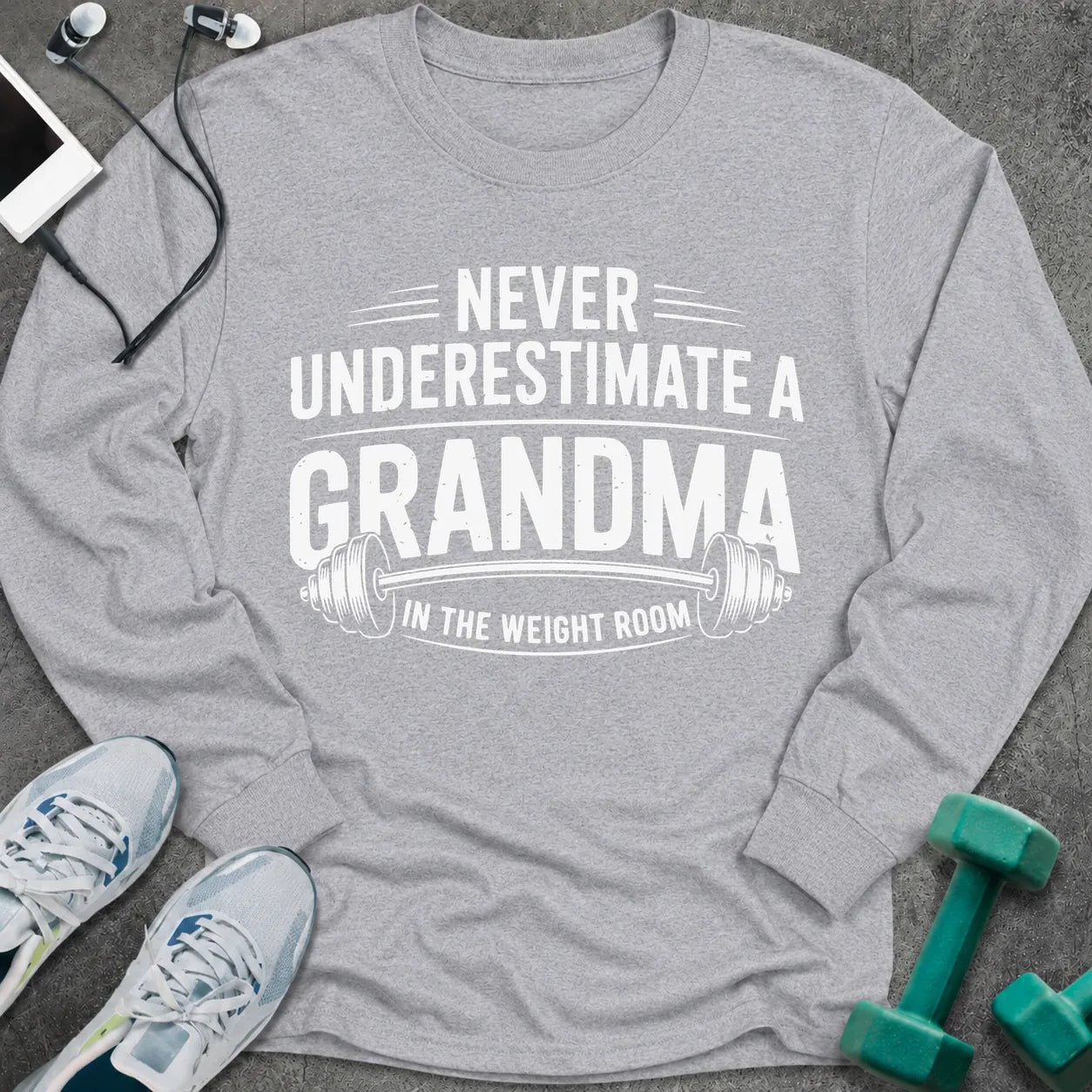 Sport grey long sleeve tee printed with "Never Underestimate A Grandma In The Weight Room" in white, with a barbell