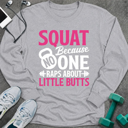 Sport grey long sleeve tee printed with "Squat Because No One Raps About Little Butts" in pink and white, with a kettlebell and dumbbells worked into the lettering