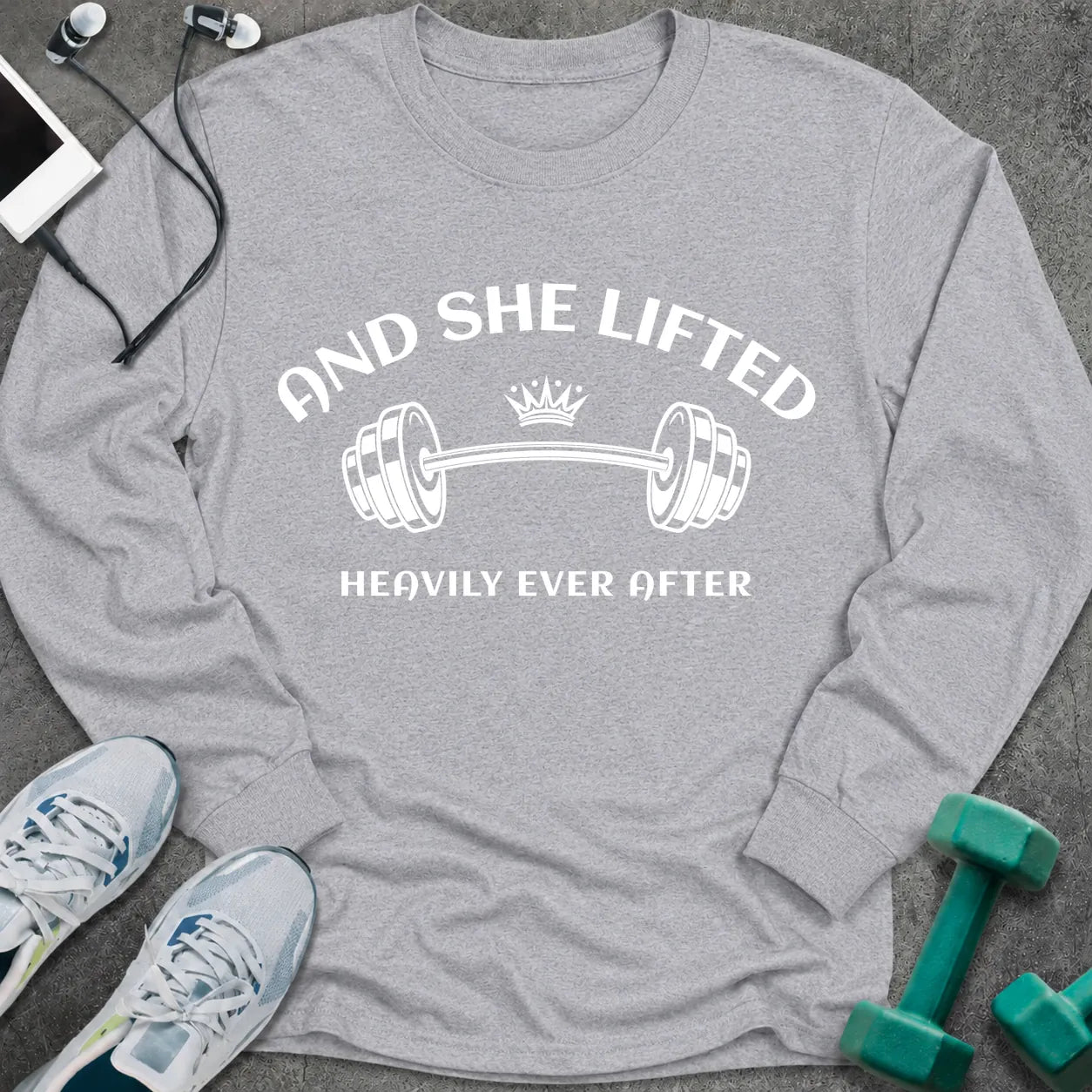 Sport grey long sleeve tee printed with "And She Lifted Heavily Ever After" in white, with a barbell topped with a crown