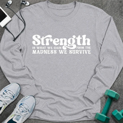 Sport grey long sleeve tee printed with "Strength Is What We Gain From The Madness We Survive" in white