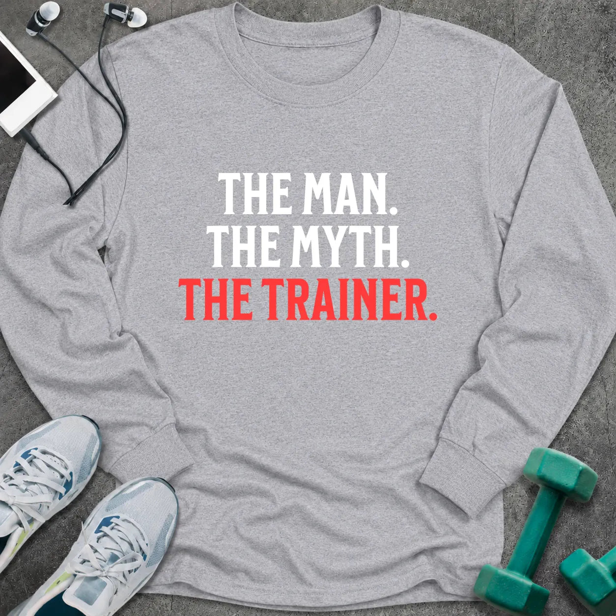 Sport grey long sleeve tee printed with "The Man. The Myth. The Trainer." in white and coral