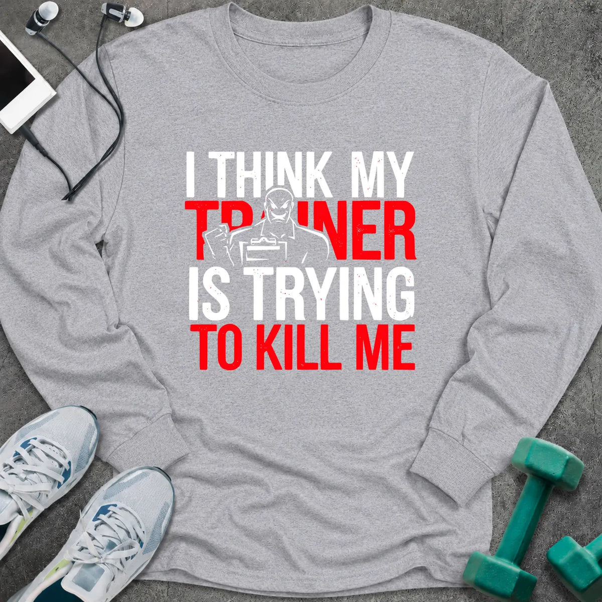 Sport grey long sleeve tee printed with "I Think My Trainer Is Trying To Kill Me" in white and red, with a trainer figure behind the lettering