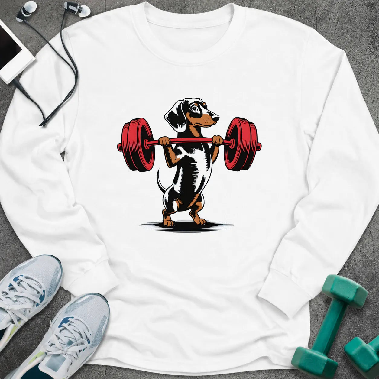 White long sleeve tee printed with a dachshund pressing a red barbell overhead