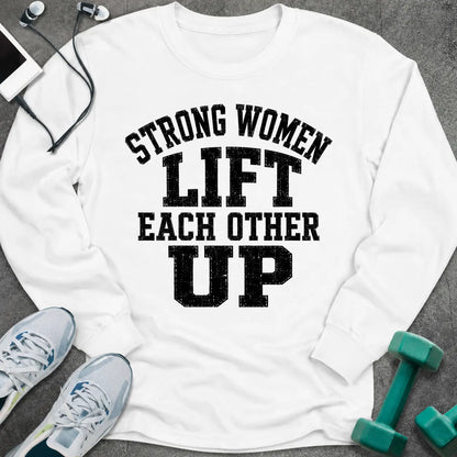 White long sleeve tee printed with "Strong Women Lift Each Other Up" in black distressed varsity lettering