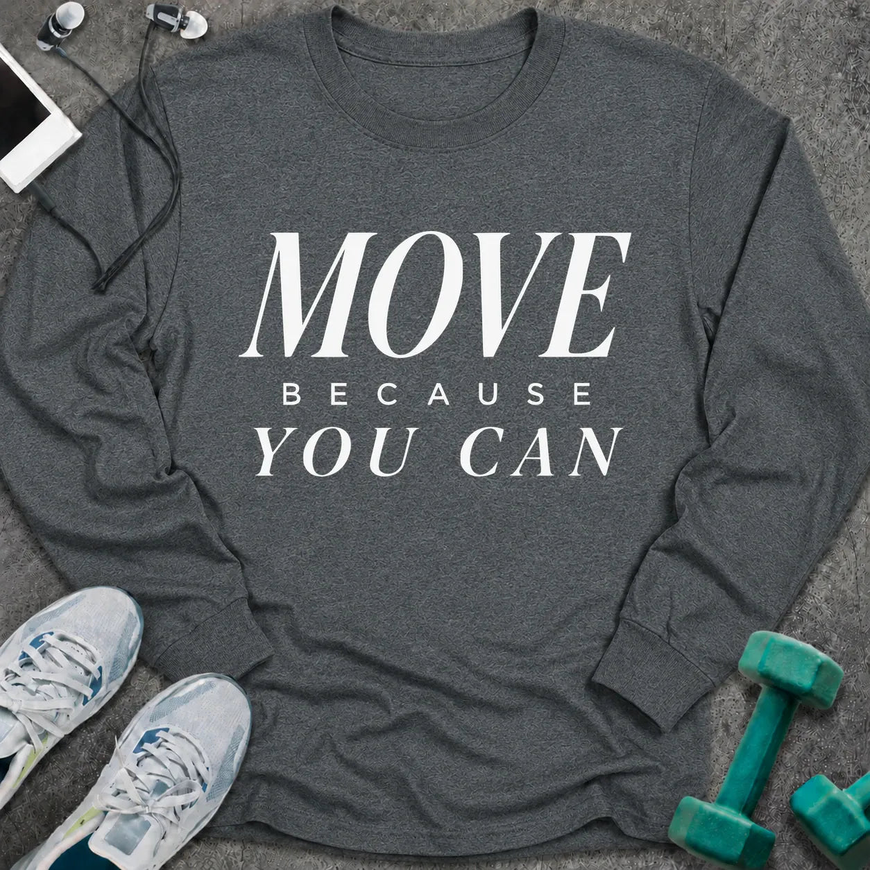 Dark heather long sleeve tee printed with "Move Because You Can" in white serif lettering