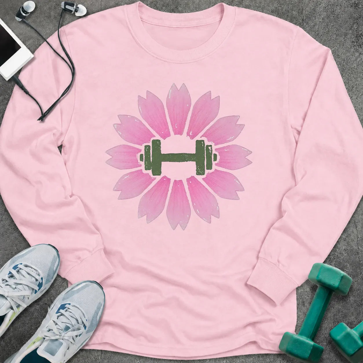 Light pink long sleeve tee printed with a pink cherry blossom with a green dumbbell at its center