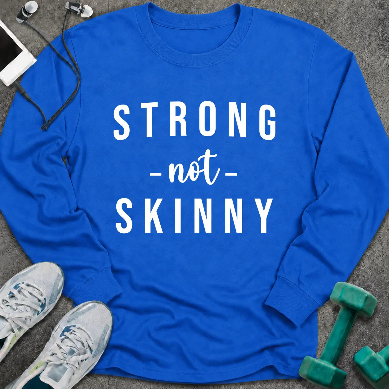Royal long sleeve tee printed with "Strong Not Skinny" in white
