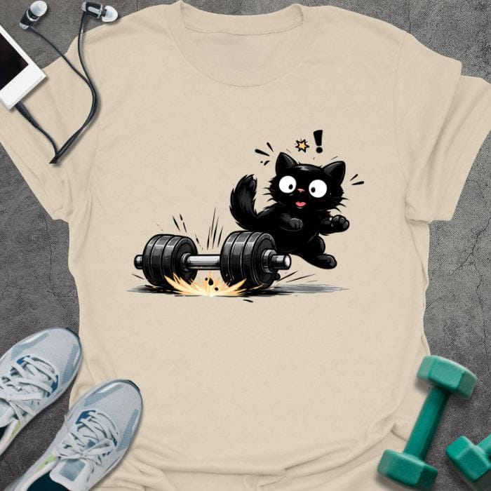 Cream t-shirt showing shocked black cat with falling dumbbell in line art style