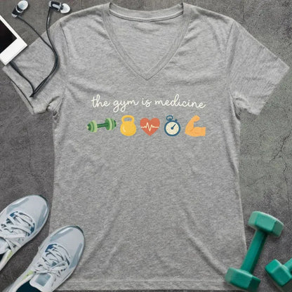 Athletic heather t-shirt printed with "the gym is medicine" in yellow and orange, with dumbbell, kettlebell, heartbeat, weight scale, clock, and bicep graphics
