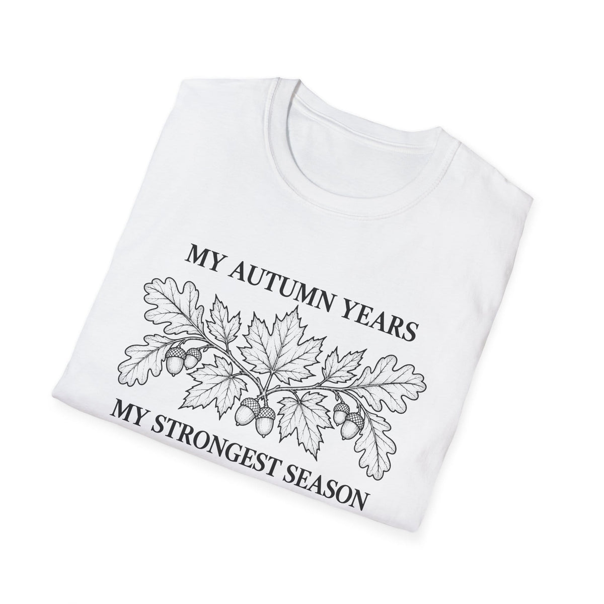 Folded white t-shirt printed with "MY AUTUMN YEARS, MY STRONGEST SEASON" in black, with oak leaves and acorns
